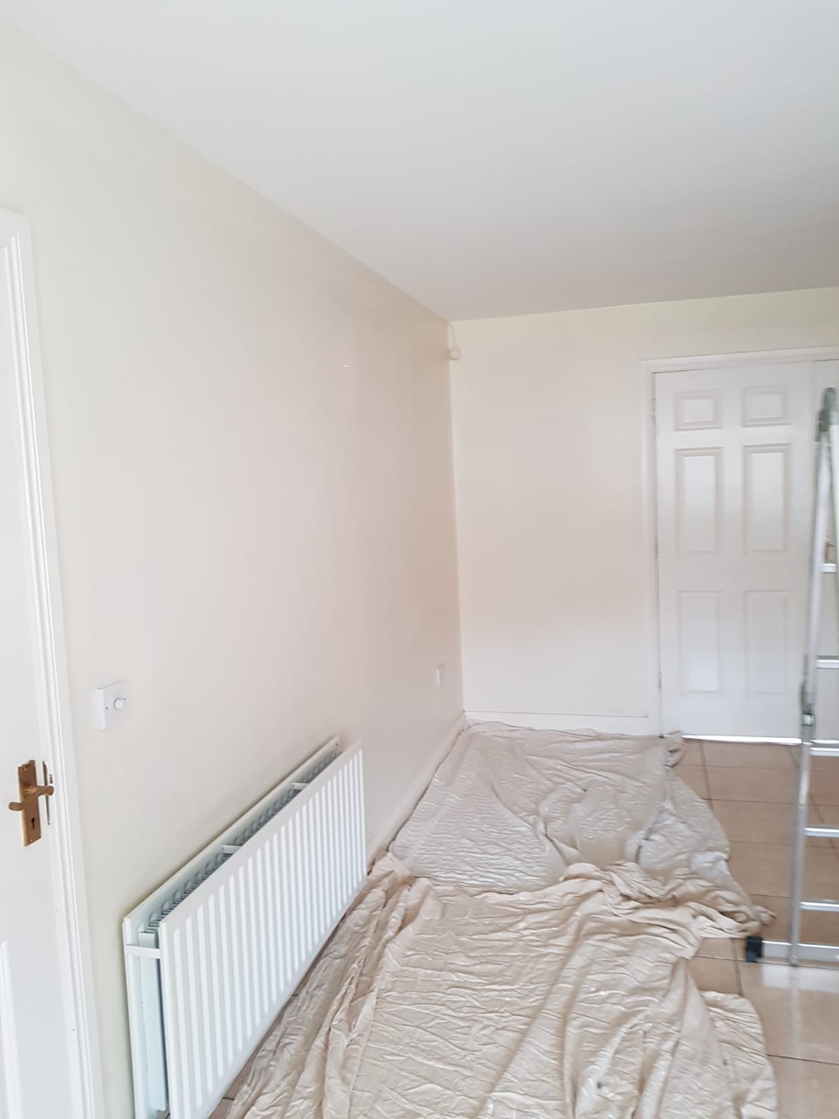 Room being painted with dust sheets down in Monaghan